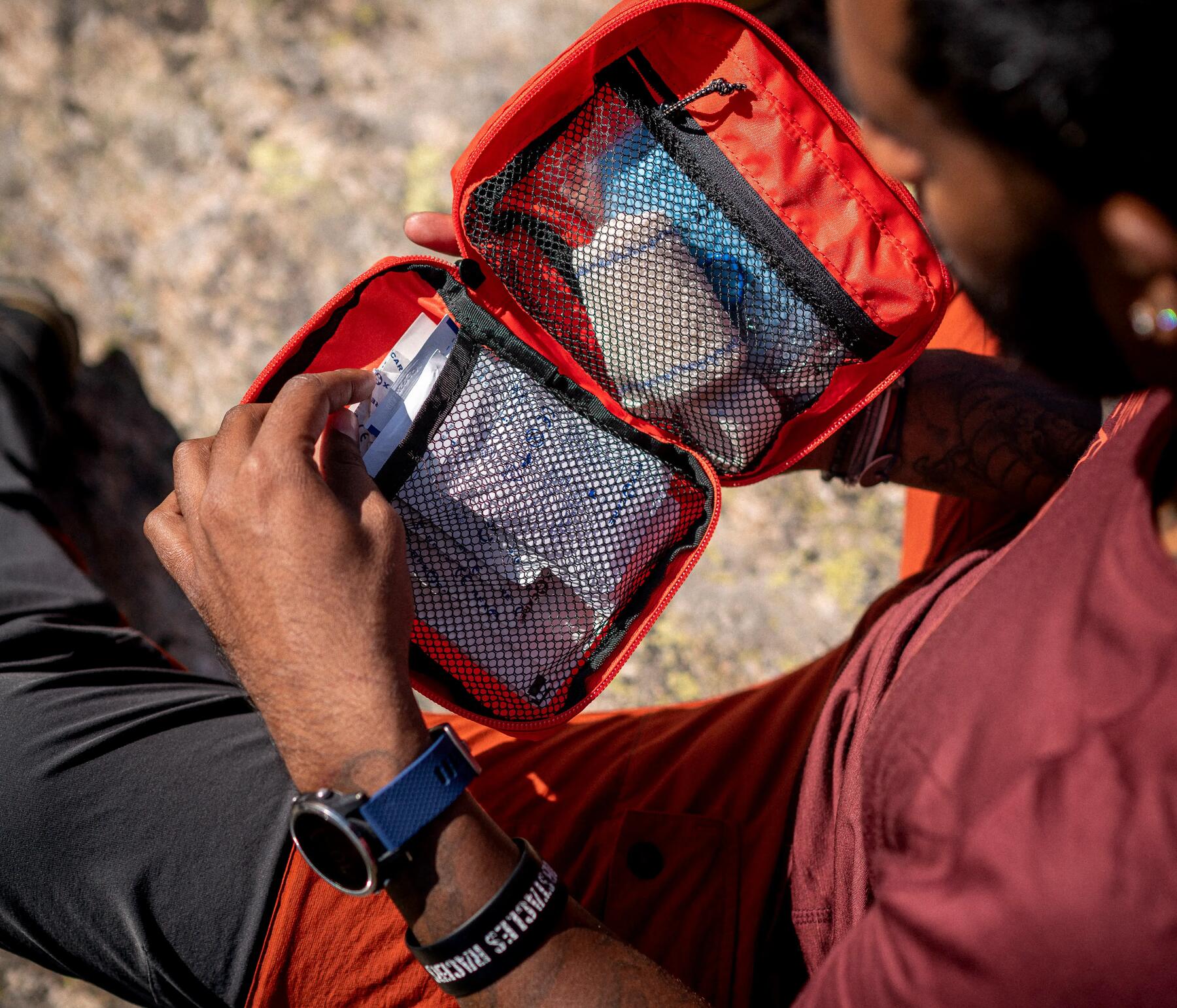 man holding FIRST-AID KIT 100 41 PIECES