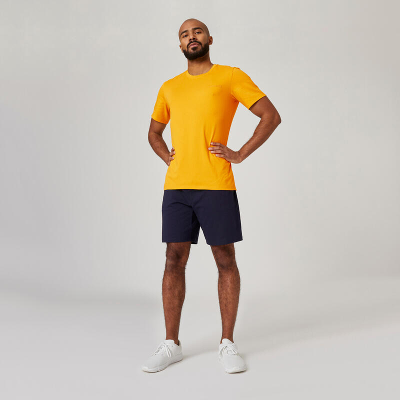 T-shirt uomo fitness 500 regular misto cotone gialla con stampa