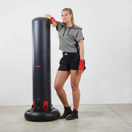 Freestanding inflatable punching bag with weightable base