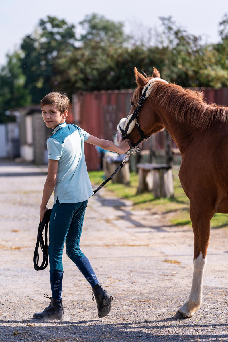 Polo manches courtes équitation enfant 500 vert clair et vert pétrole