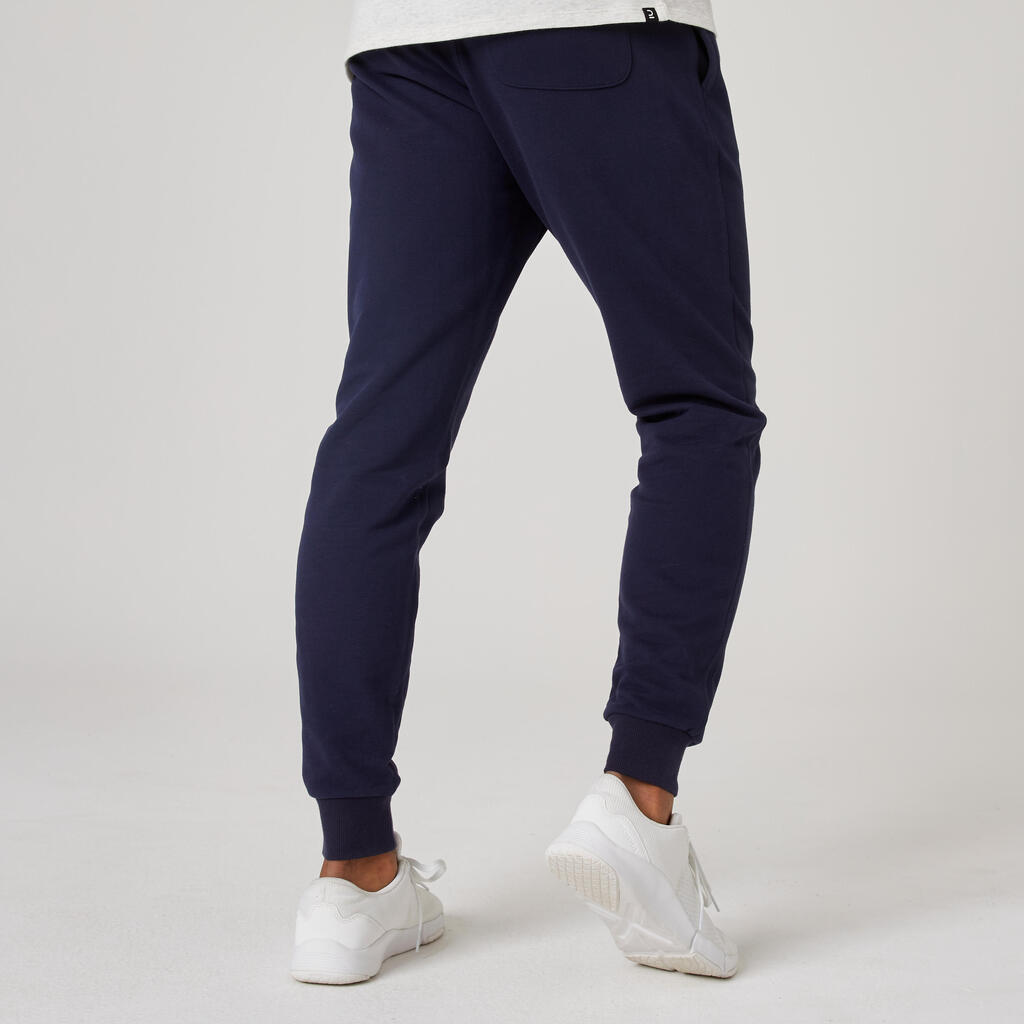 Pantalón de fitness tipo jogger de fitness de corte slim gris para hombre 500