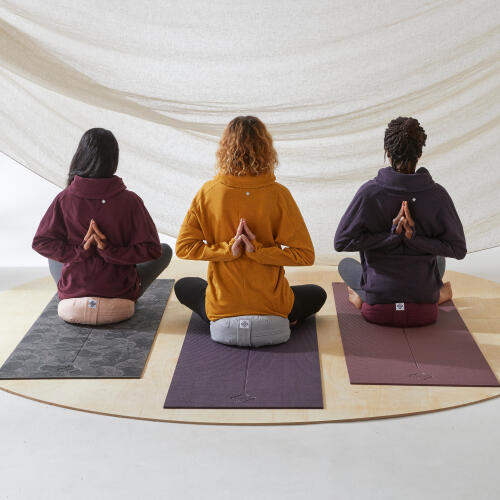 WOMAN SITTING ON ZAFU