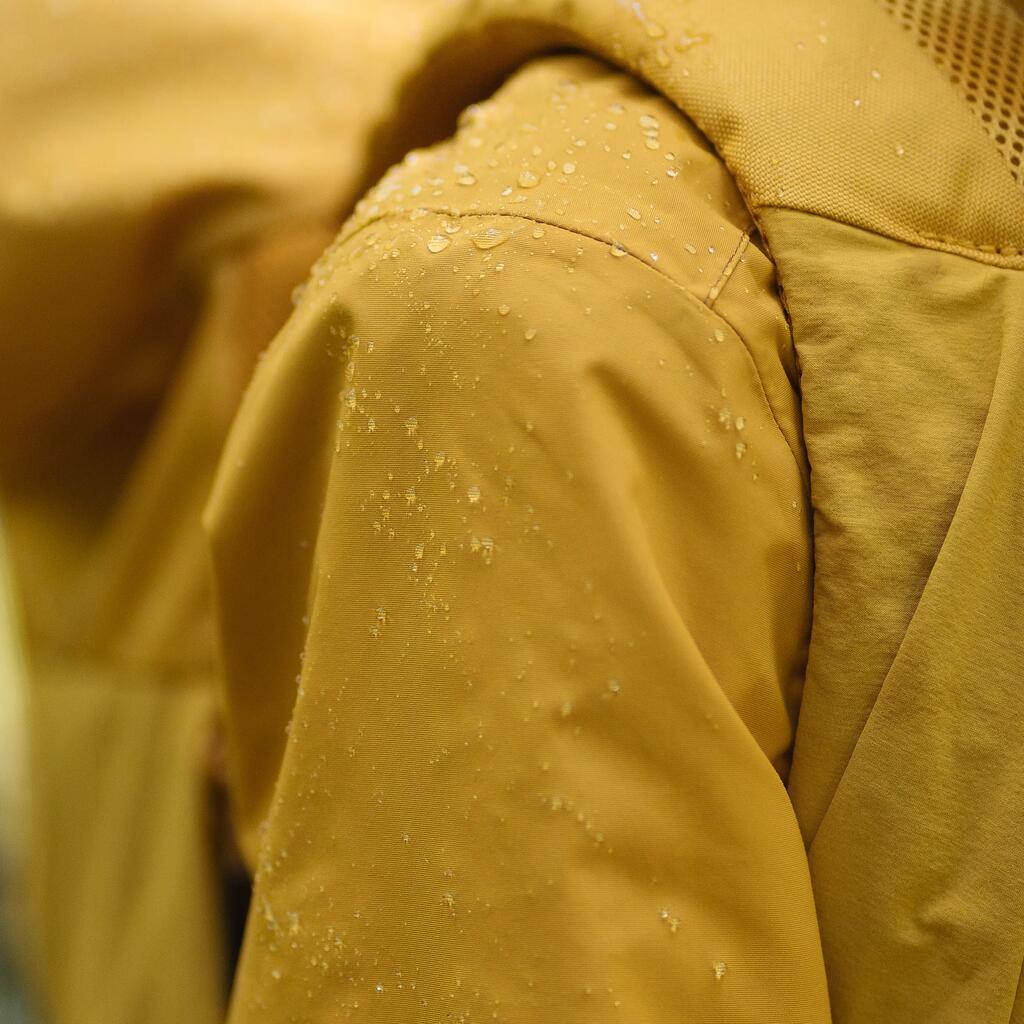 Chaqueta impermeable tipo gaban para senderismo Mujer NH550 Quechua amarillo