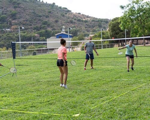 Group of people playing badminton