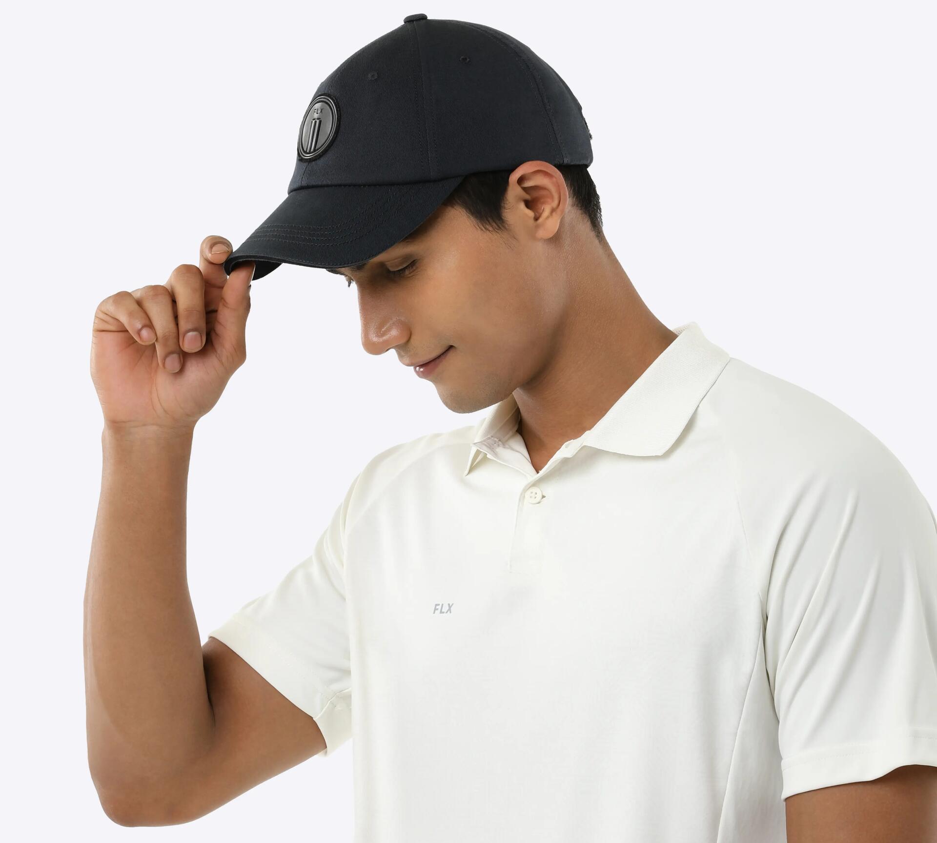 man posing with his cricket cap