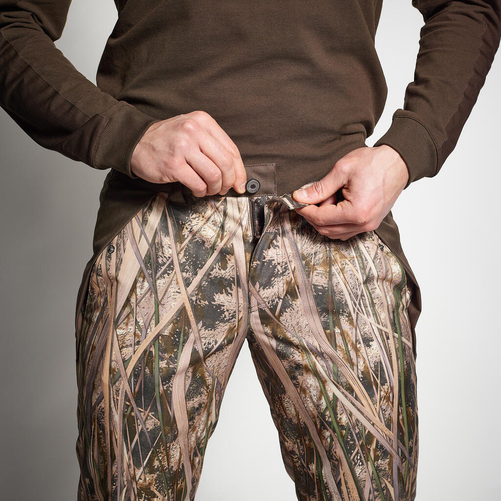 100 warm and waterproof hunting trousers with wetlands camouflage