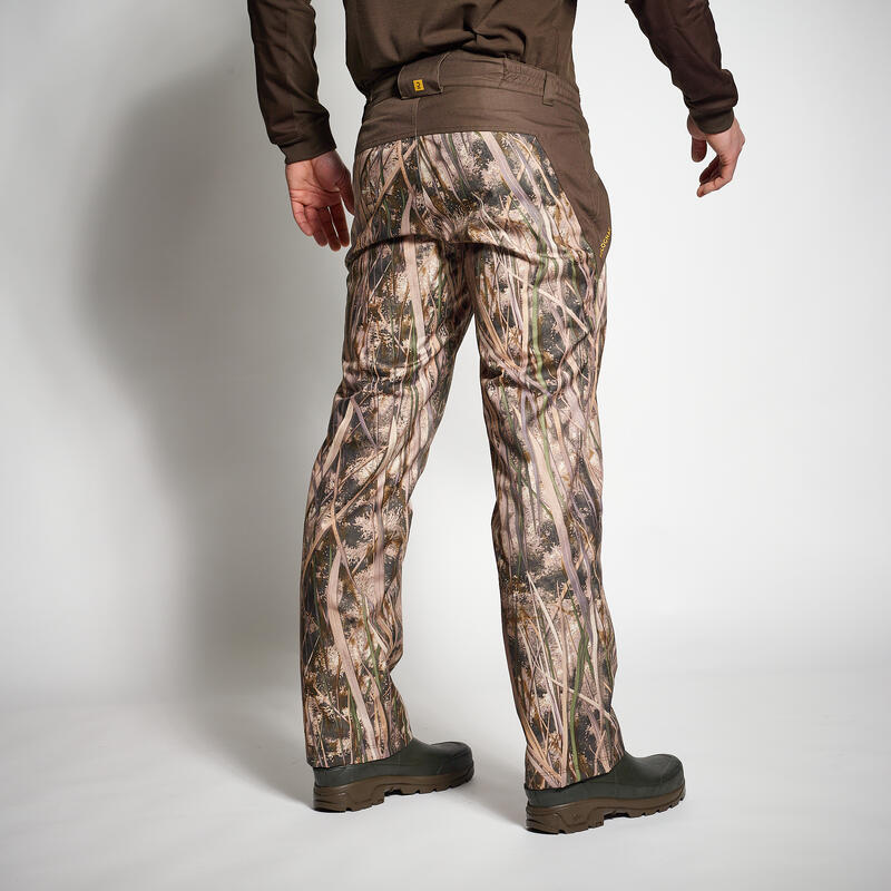 100 warm and waterproof hunting trousers with wetlands camouflage