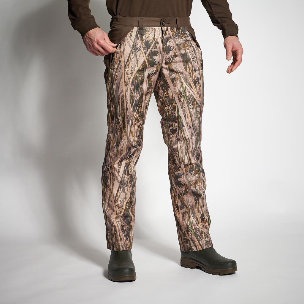 100 warm and waterproof hunting trousers with wetlands camouflage