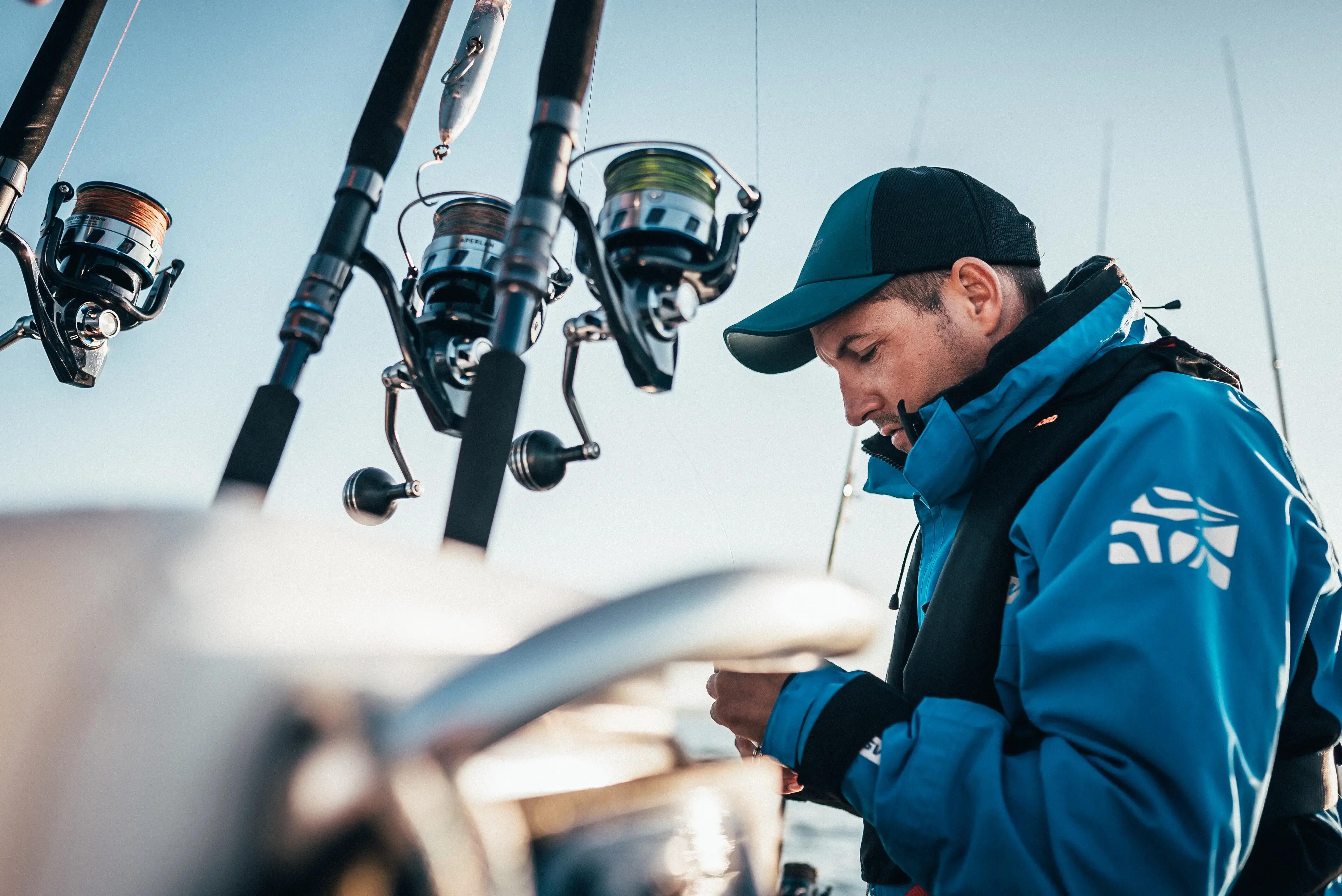 Angler preparing a fishing reel on a fishing boat