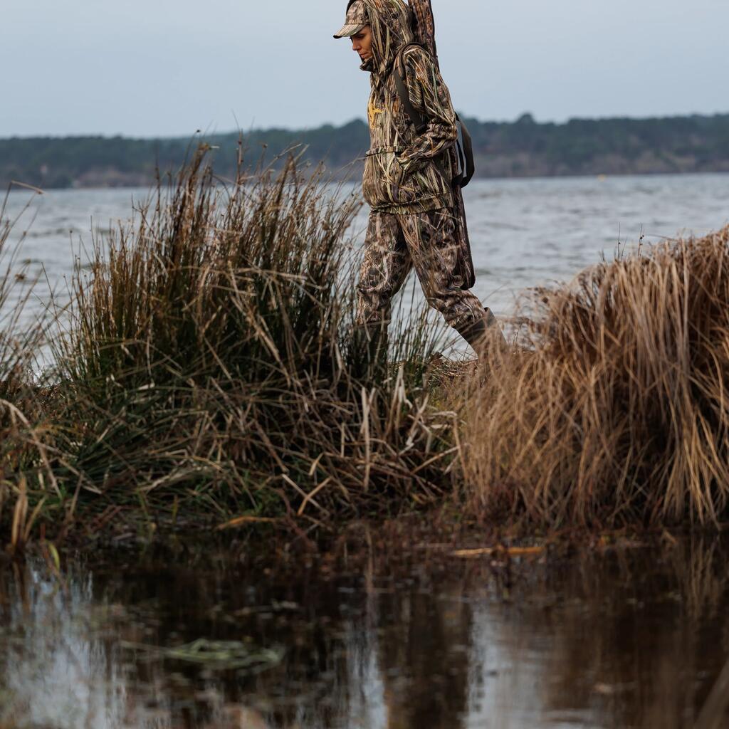 100 warm and waterproof hunting trousers with wetlands camouflage