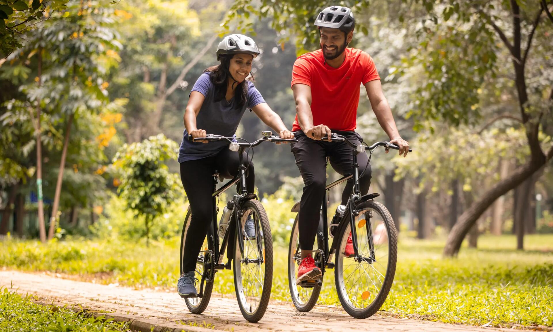 A man and woman riding mountain bikes