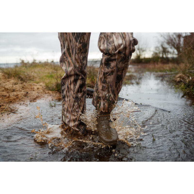 100 warm and waterproof hunting trousers with wetlands camouflage