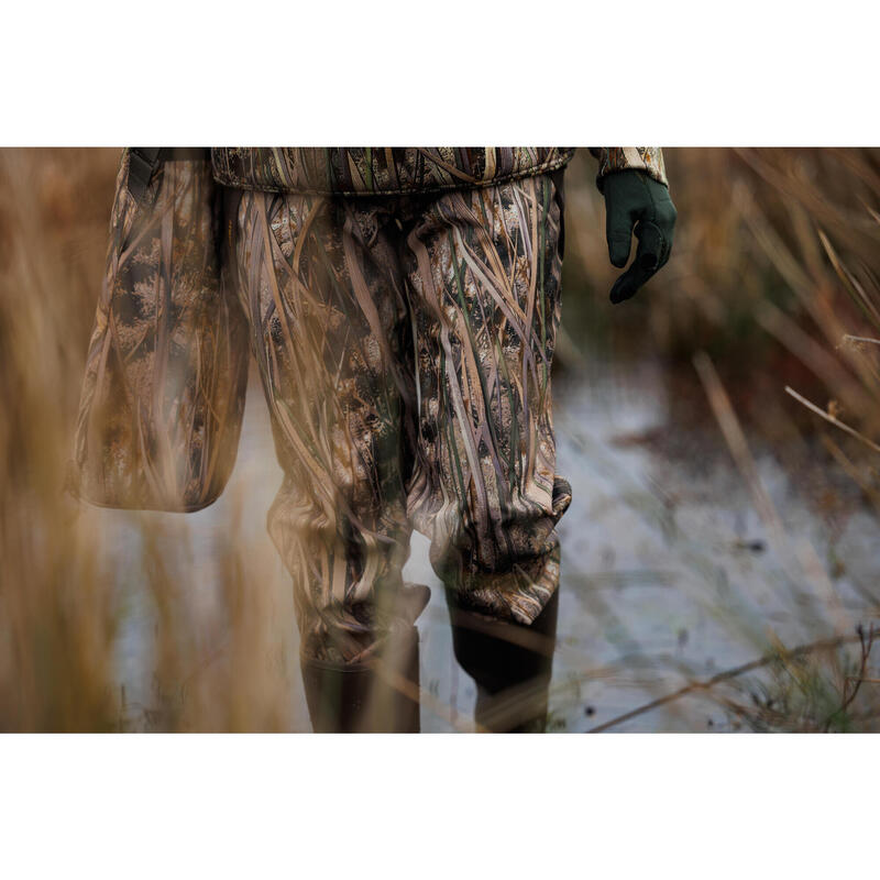 100 warm and waterproof hunting trousers with wetlands camouflage