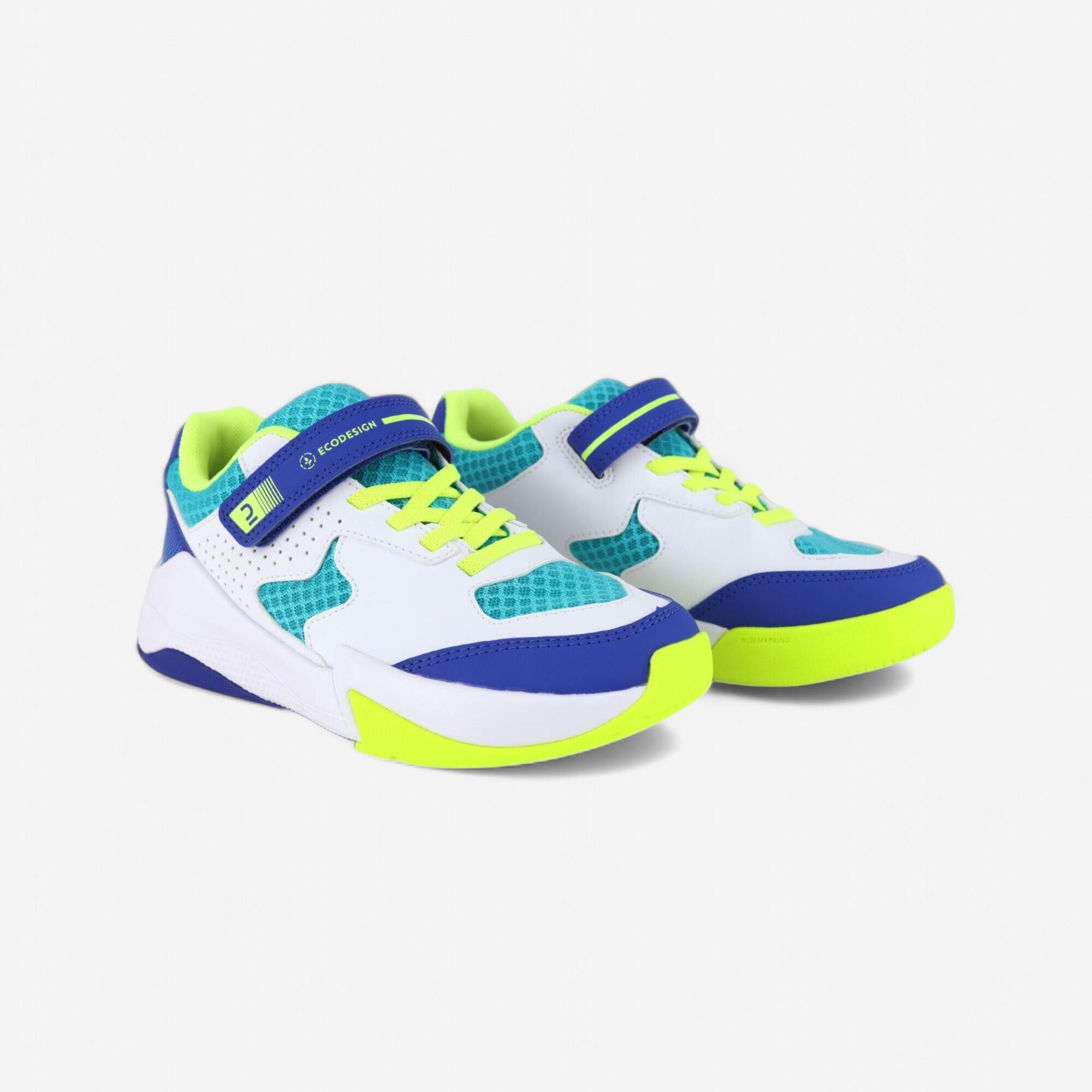 VS100 comfort volleyball shoes with white/blue and green velcro straps.