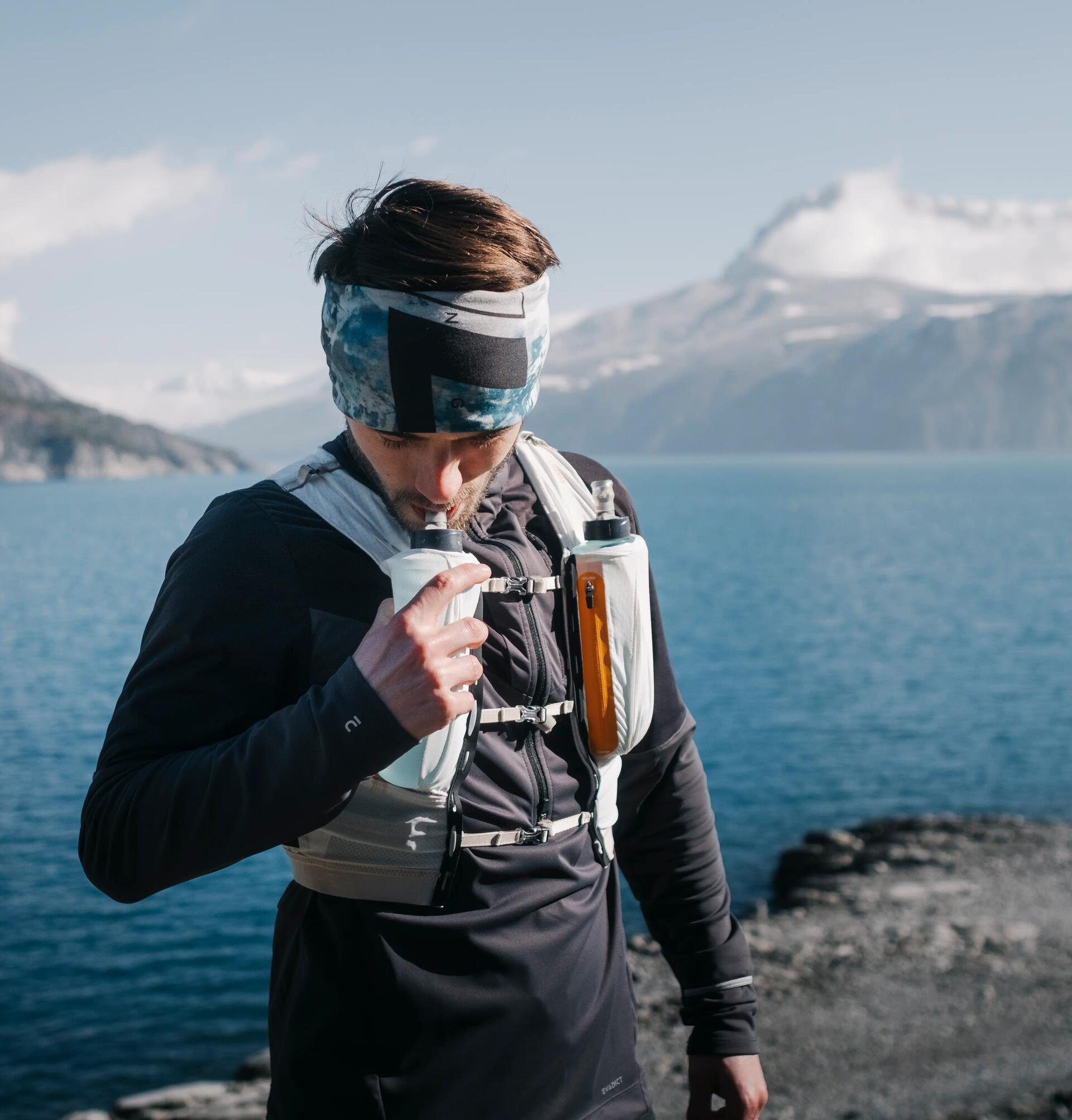 man drinking out of his hydration pack