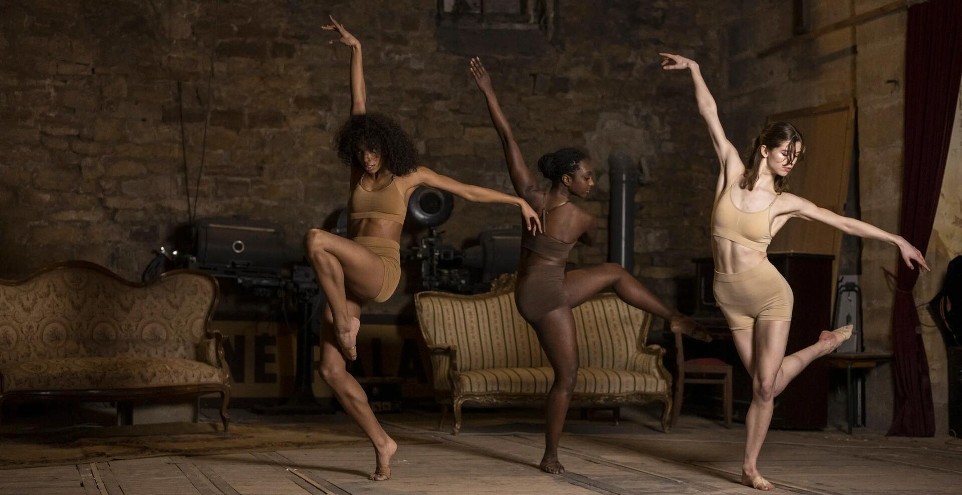 three women posing in ballet poses