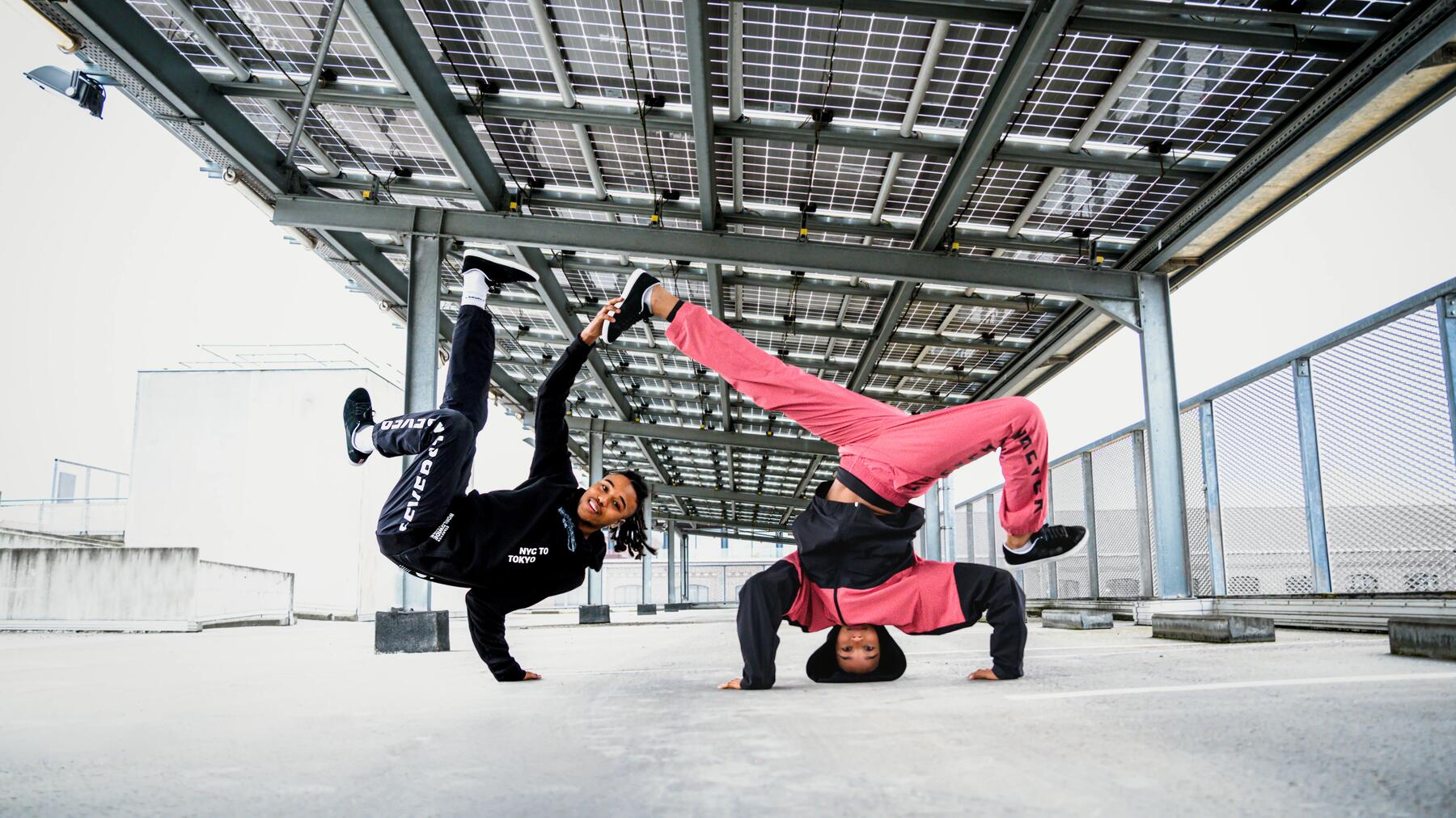 two dancers taking a break in a warehouse