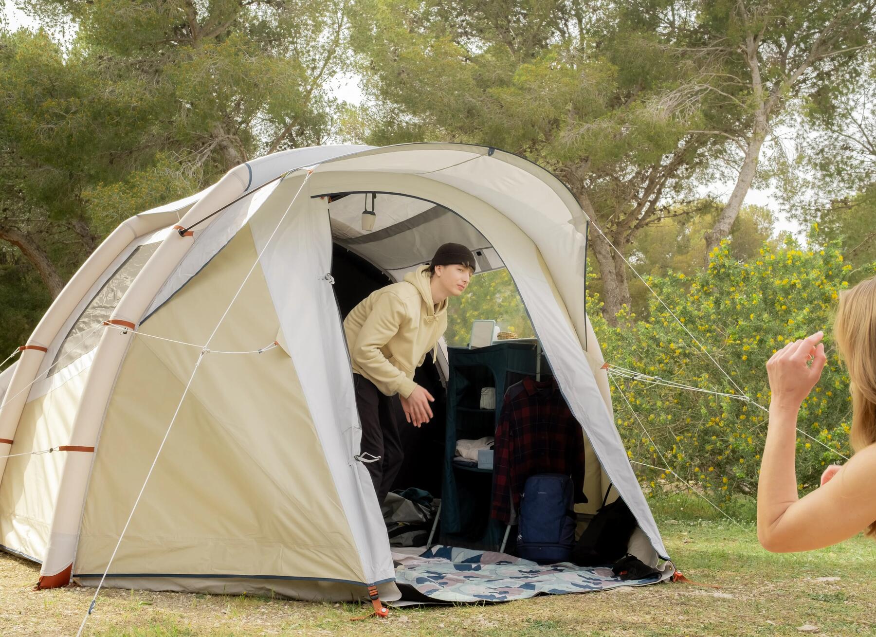 Person inside a geodesic tent