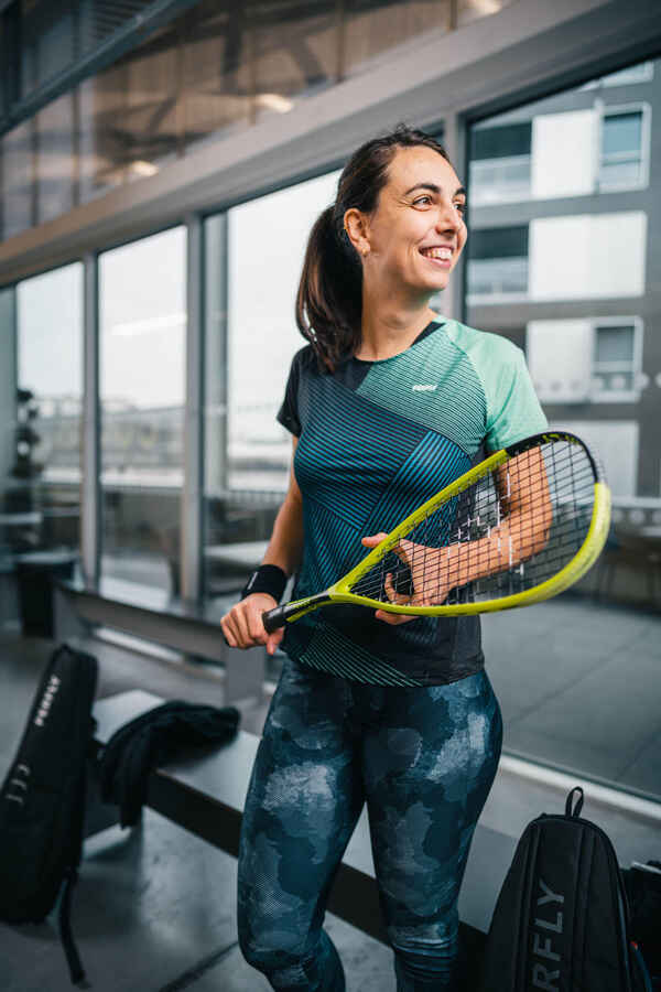A person holding a racket