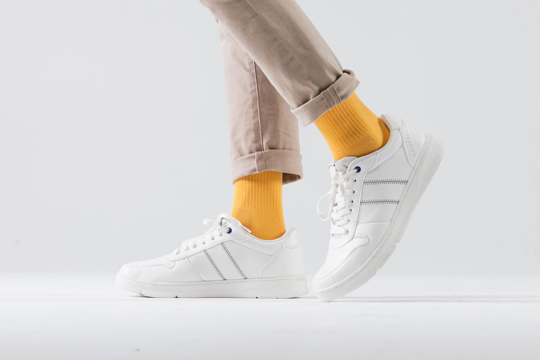 Close up of person wearing yellow walking socks