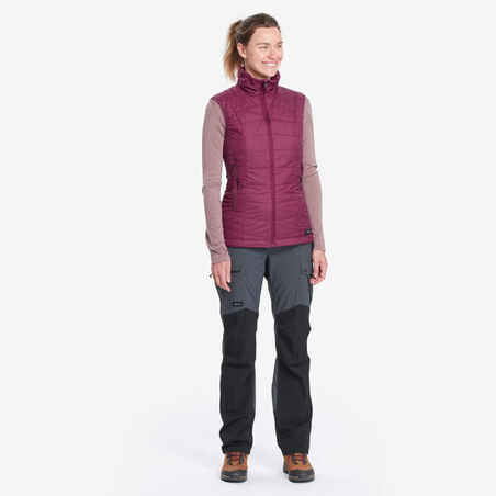 Women’s synthetic sleeveless trekking padded jacket MT100 - Purple