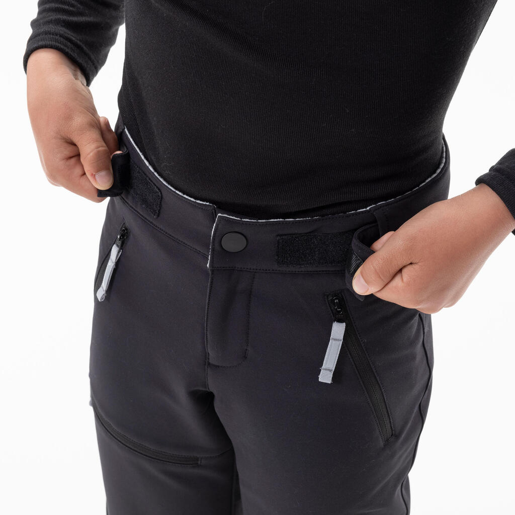 PANTALONE ZA PLANINARENJE SH500 DEČJE SOFTSHELL TOPLE - CRNE