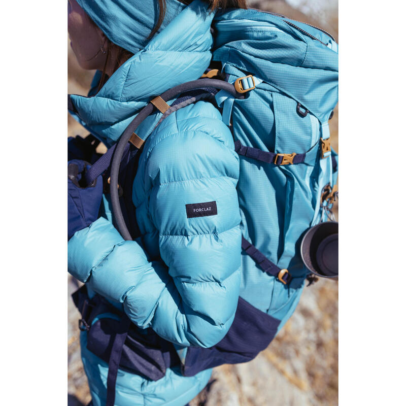 Daunenjacke Damen Kapuze bis -10 °C Trekking - MT500 türkis