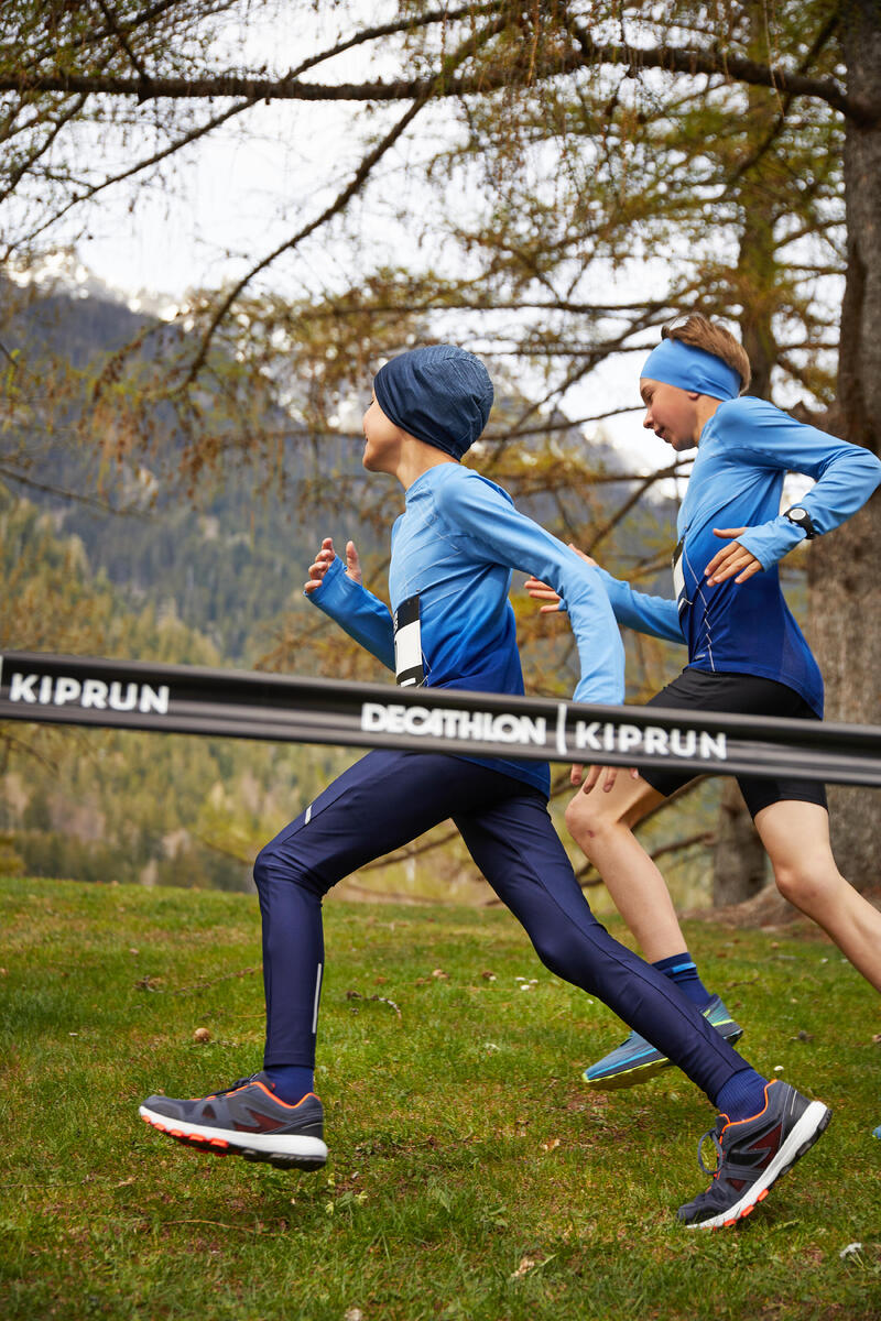 CALÇADO DE CORRIDA E ATLETISMO CRIANÇA KIPRUN GRIP CINZENTO/PRETO/LARANJA NÉON