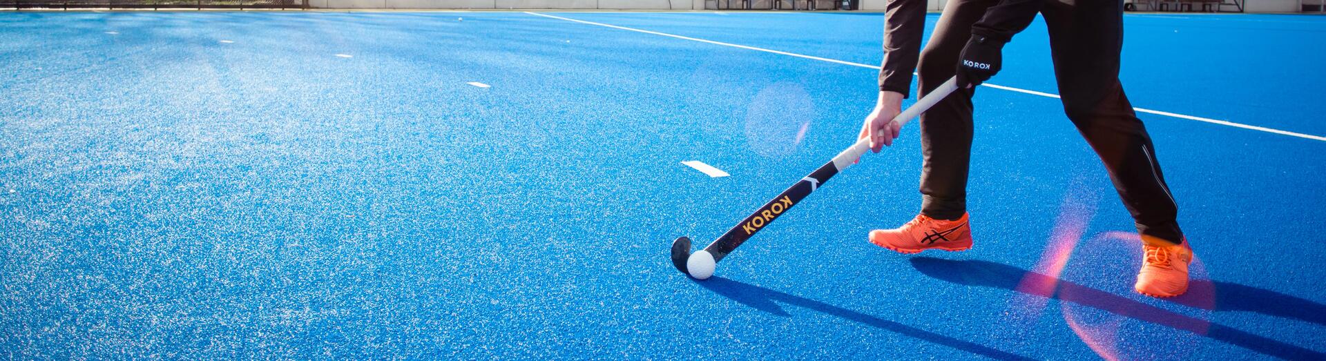 Young boy playing hockey outside