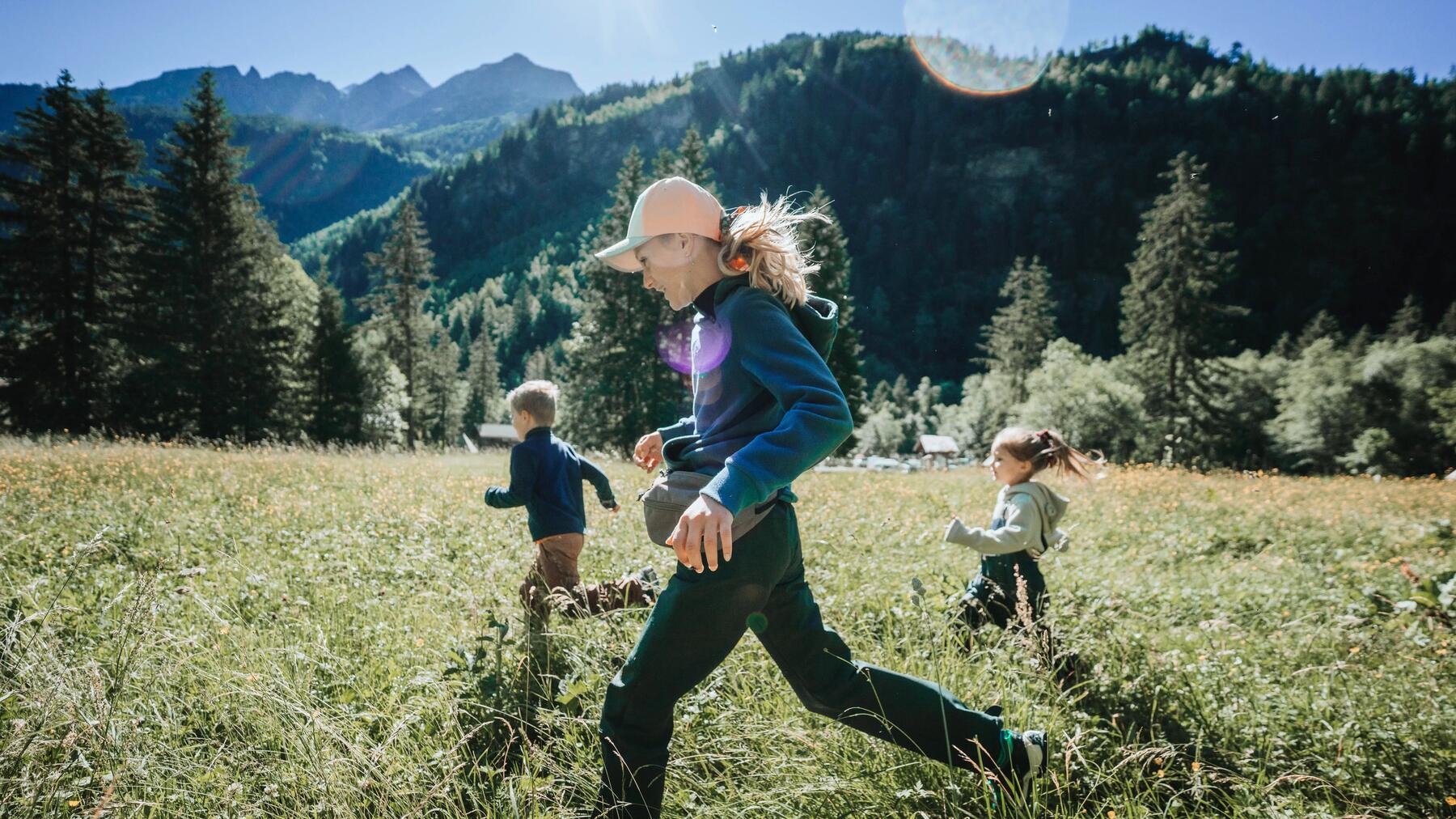 young boy drinking from a hydration pack