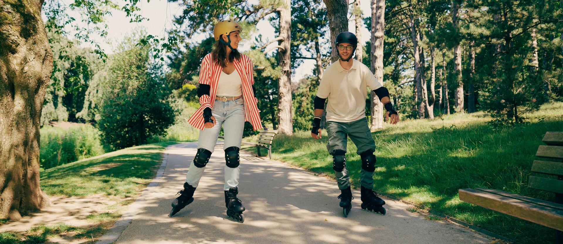 Three people riding roller skates in the park
