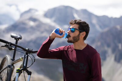 A biker drinking