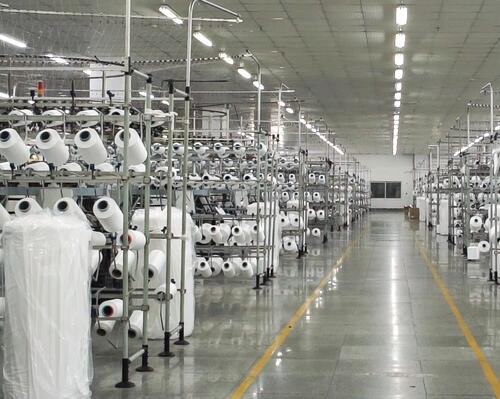 Picture of white bobbins in a warehouse