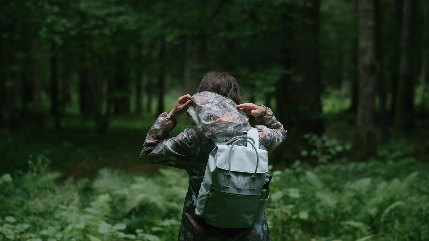 child exploring the ground on a hike