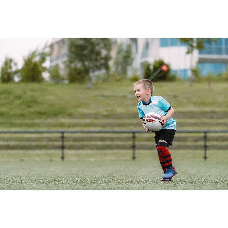 Botas de rugby con tacos fijos Easylace terrenos secos Niño - SKILL100 FG  azul rojo