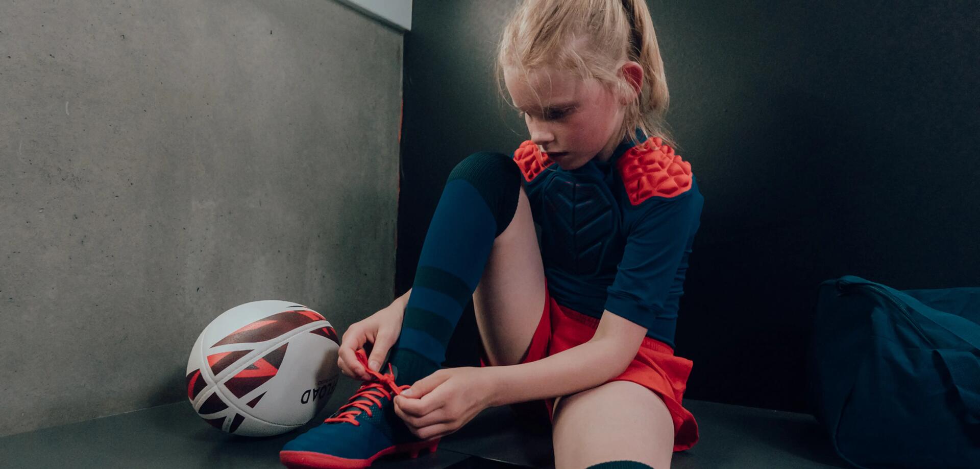 Girl wearing a pair of rugby shoes