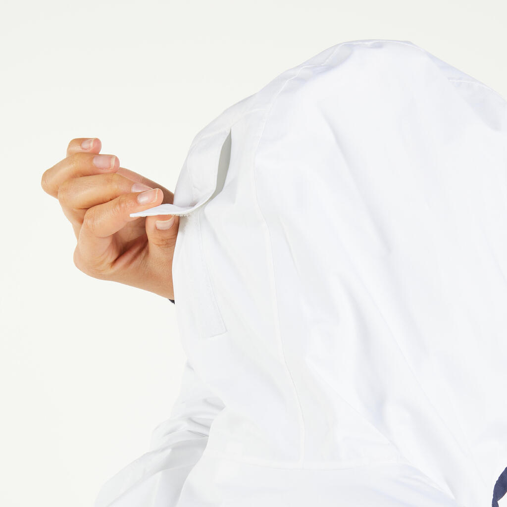 Chamarra de vela impermeable blanco con naranja para mujer Sailing 100