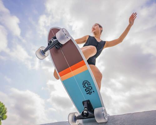 Woman Longboarding on a cloudy day