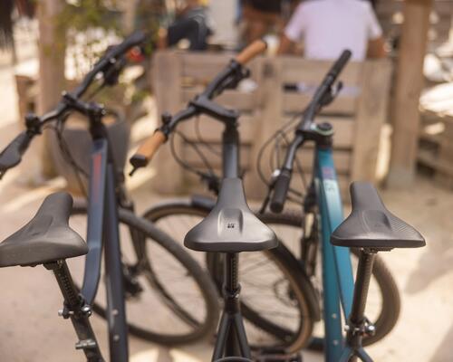 3 bikes with a close-up of the saddles