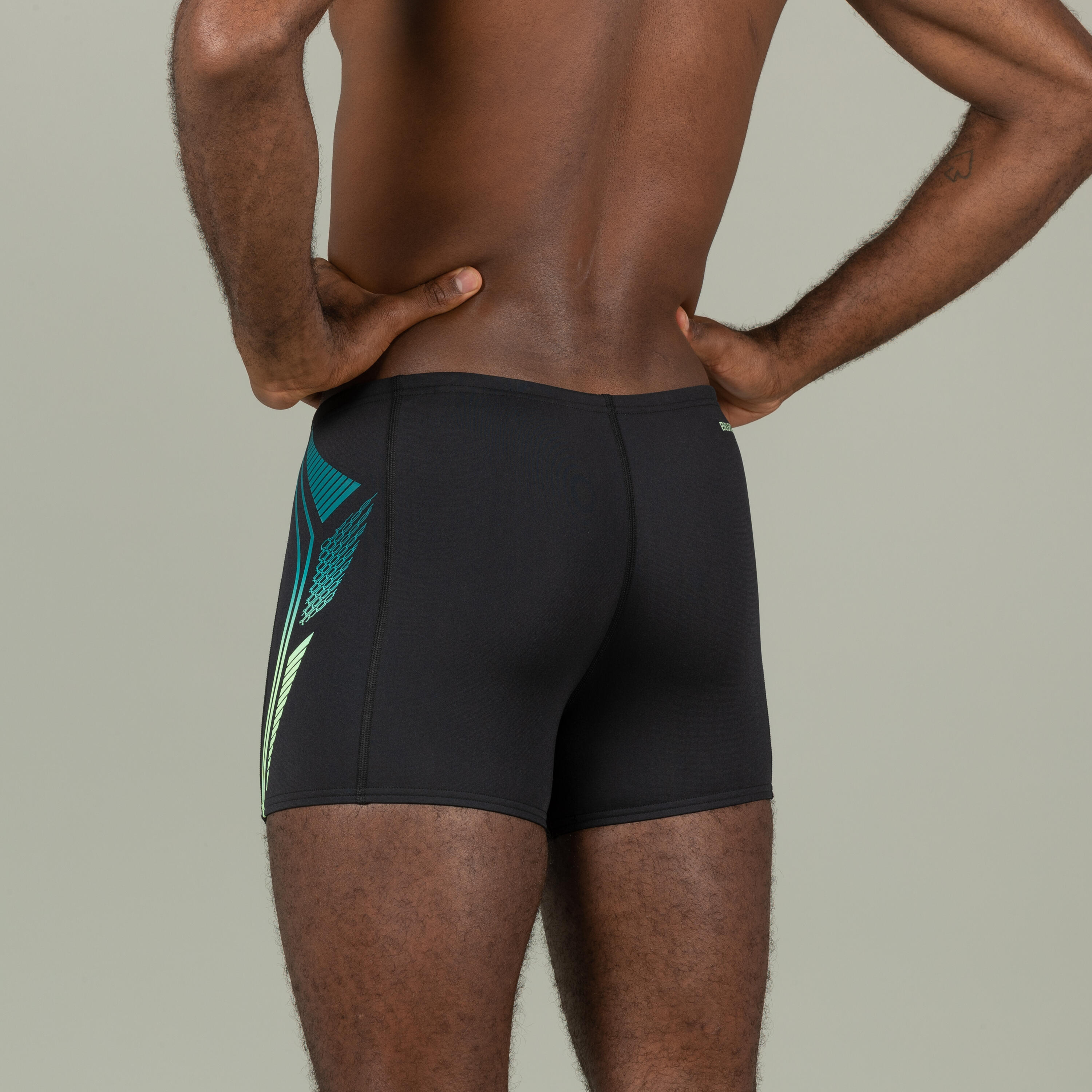 Man in green speedo deals