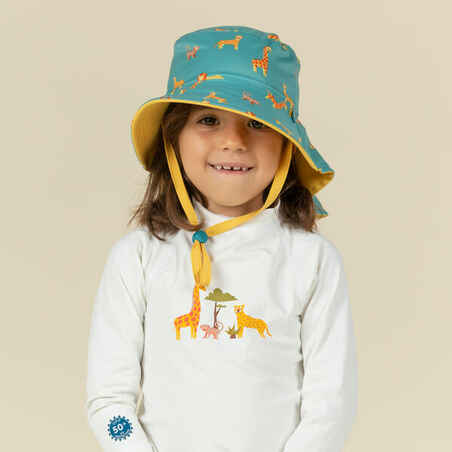 כובע דו צדדי עם הגנת UV לתינוקות  - כחול וצהוב עם הדפס SAVANA
