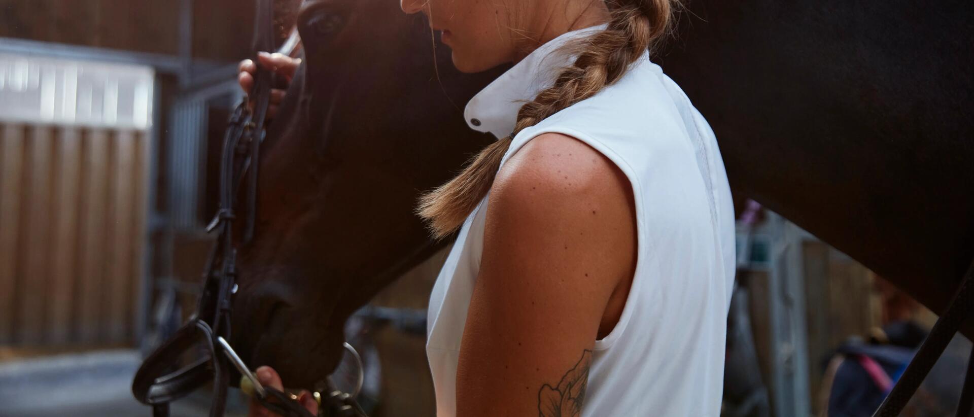 Woman guiding horse