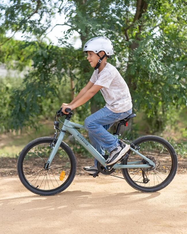 Animation: Kinderhand zieht Fahrradbremse; animertes Stopzeichen erscheint