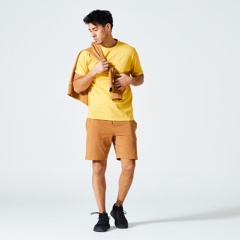 T-shirt uomo fitness 500 ESSENTIALS regular 100% cotone gialla