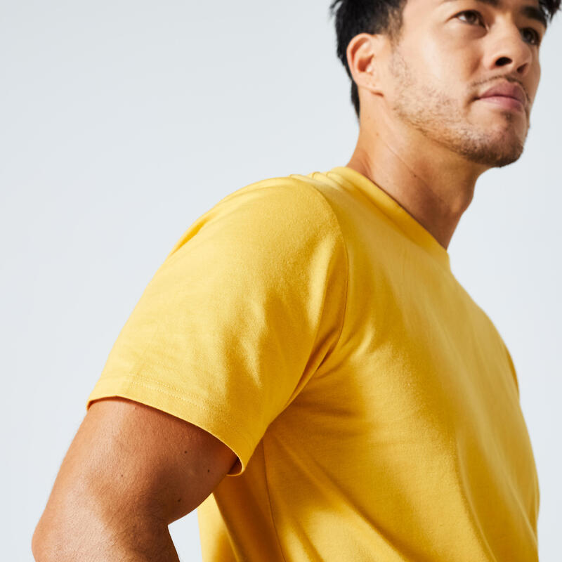 T-shirt uomo fitness 500 ESSENTIALS regular 100% cotone gialla