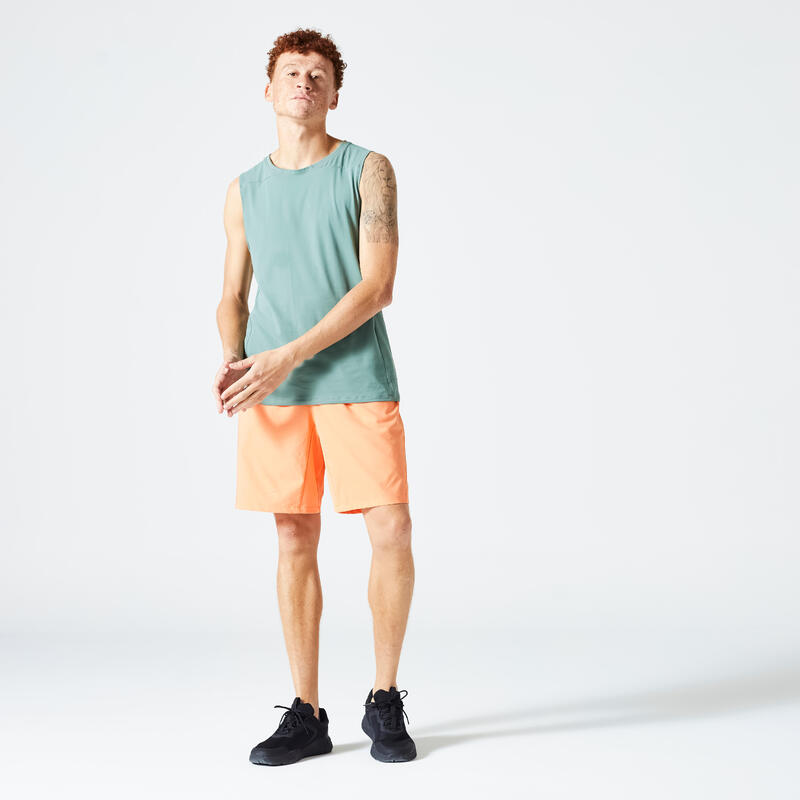 Short de fitness essentiel respirant poches zippés homme - orange