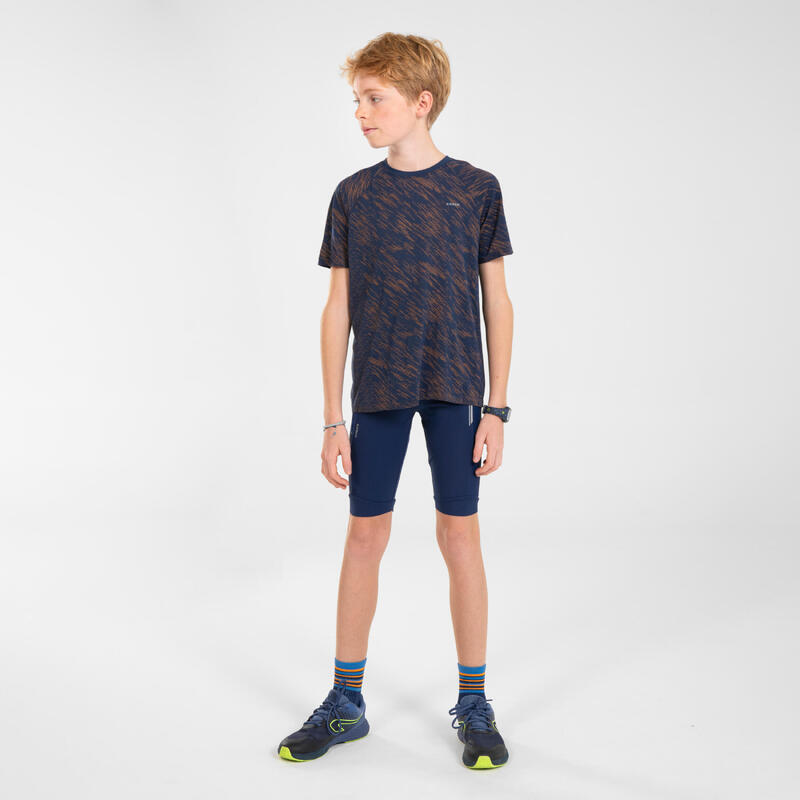 Camiseta running sin costuras Niños - KIPRUN CARE azul marino naranja
