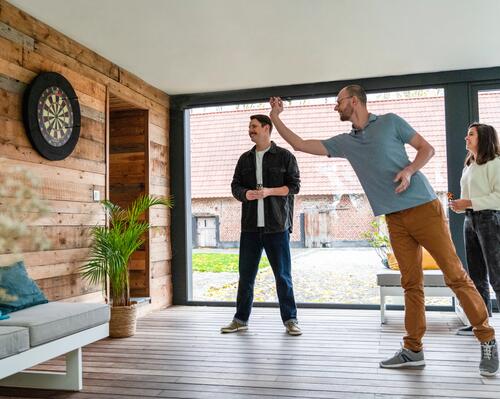 people playing darts at home