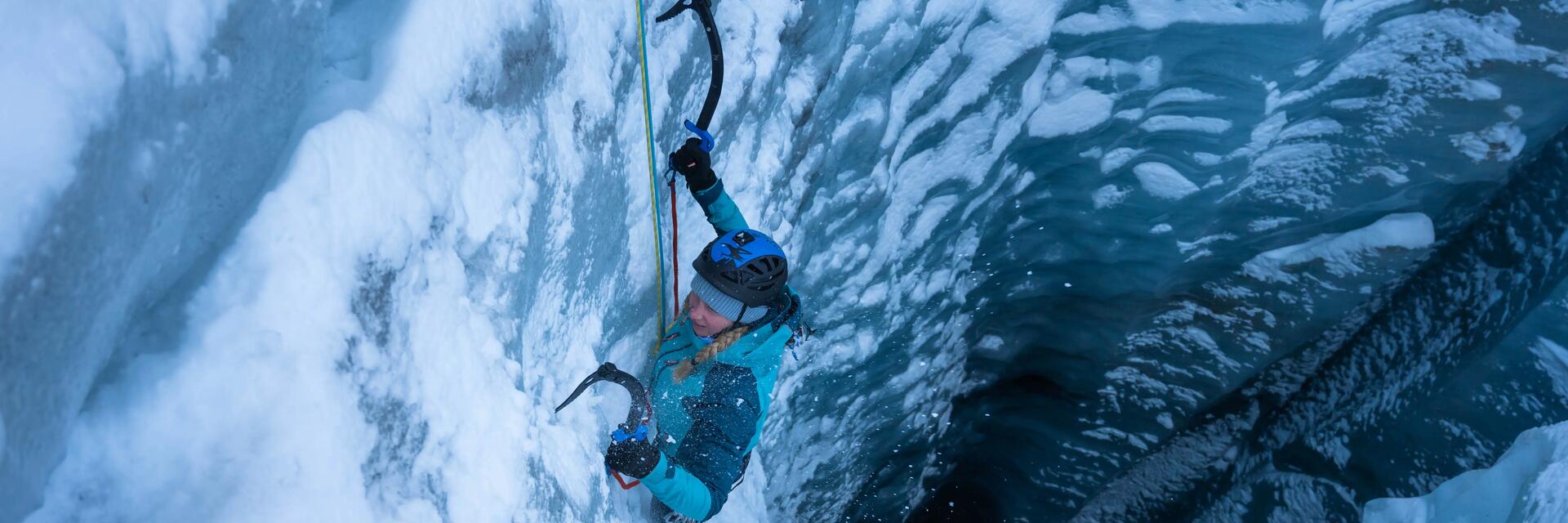woman climbing a glacier