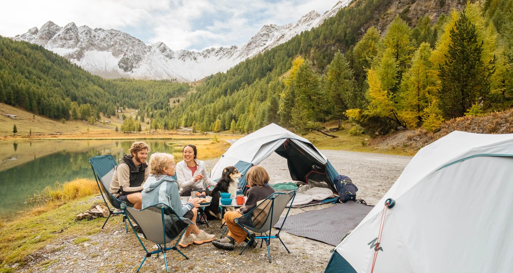 a family sat around in their camping chairs